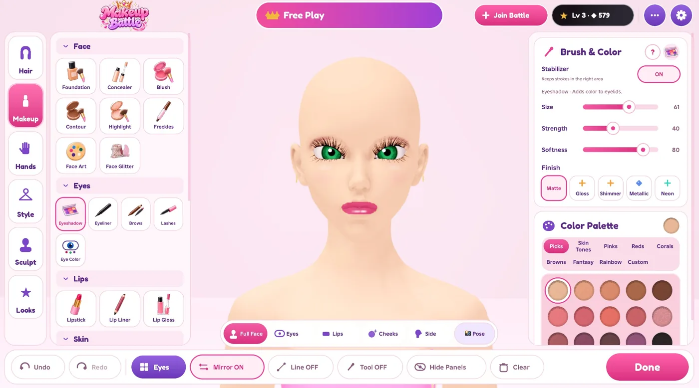 The Makeup Battle editor: makeup products on the left, the face in the middle, brush settings and colors on the right